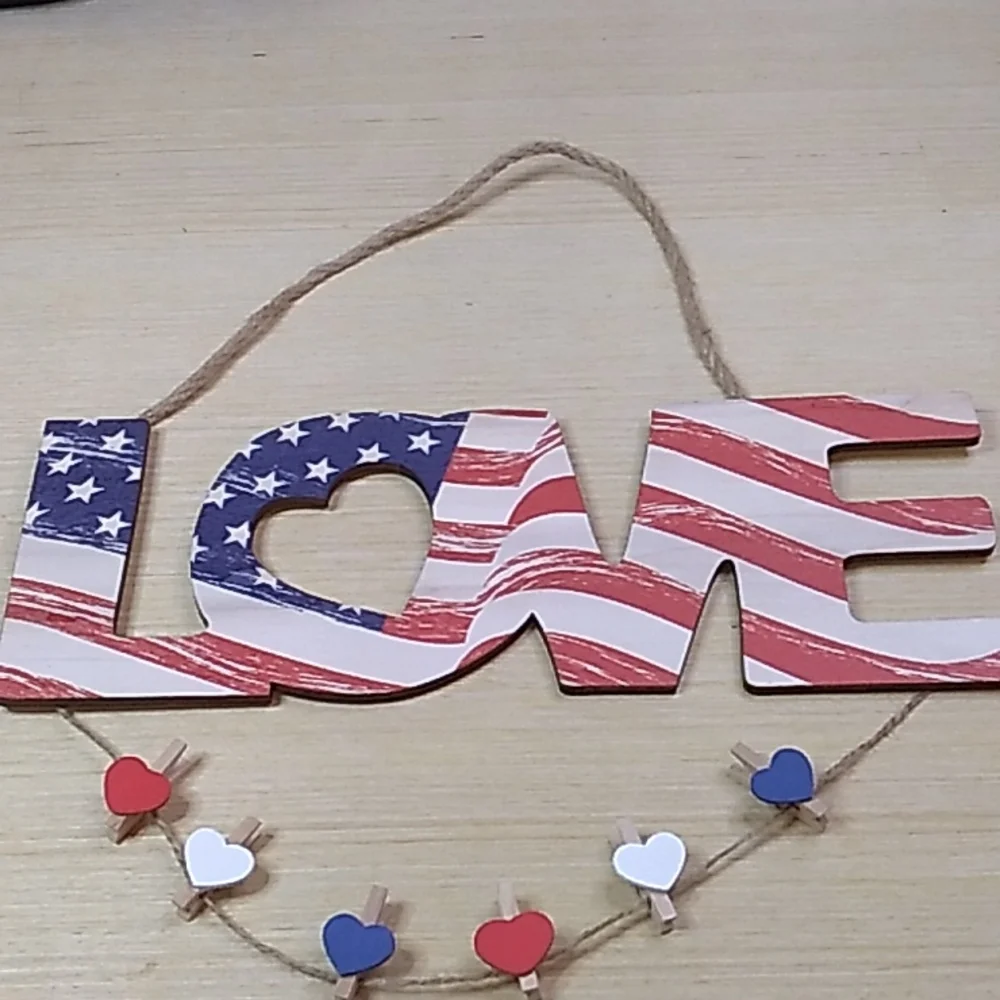 Wooden sign Love in red, white & blue. 11.5 x 4.5 inches w heart picture clips
